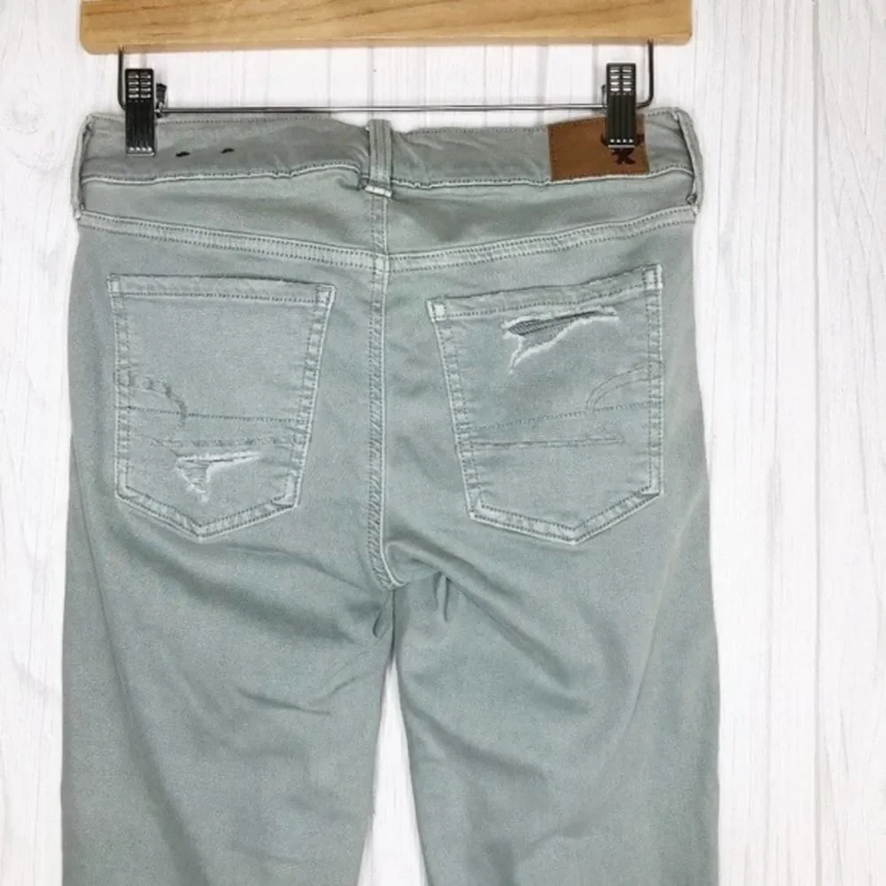 AMERICAN EAGLE Seafoam Destroyed Skinny Jeans